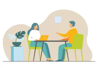 dessin de deux personnes assises autour d'une table représentant l'échange entre une assistante social et un habitant