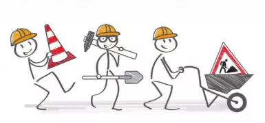 dessin représentant des bonhomme en filaire tenant différents accessoires pour travaux dont un cône, une brouette, une pelle et un triangle de signalisation, rue du commerce