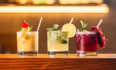 three clear glass cups with juice